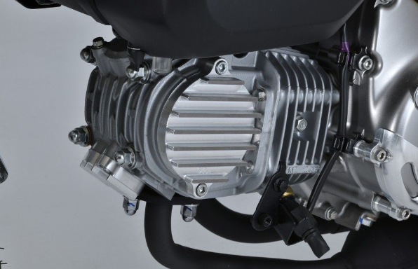 Close-up of a motorcycle engine on a gray background