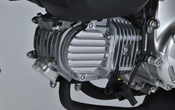Close-up of a motorcycle engine on a gray background