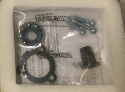 Takegawa special parts packaging with black circular components on a white background