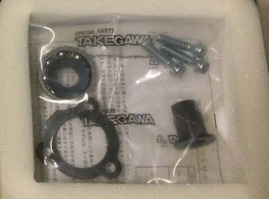 Takegawa special parts packaging with black circular components on a white background