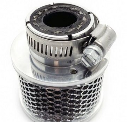 Metallic filter or exhaust component on a white background