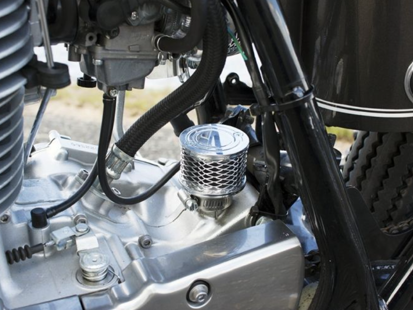 Close-up of a motorcycle engine with visible components.