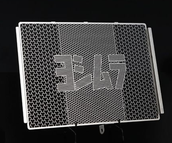 Metallic honeycomb filter with '367' branding on a black background