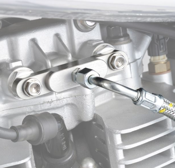Close-up of a mechanical component with a tool being used on it