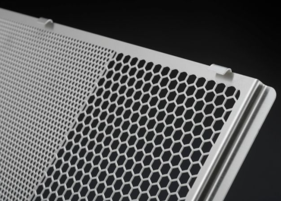 Metallic honeycomb panel on a black background