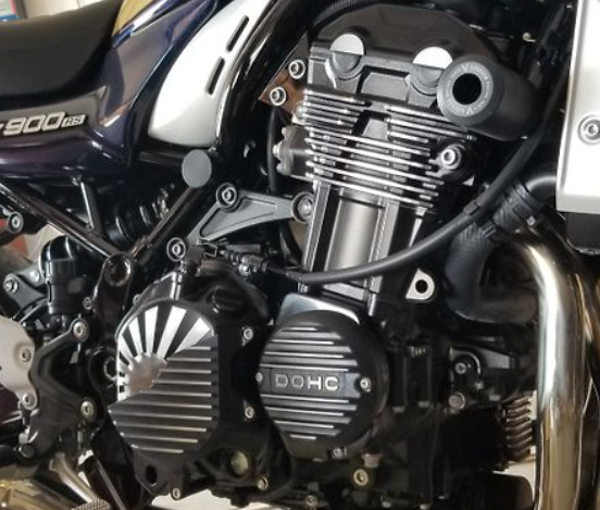 Close-up of a motorcycle engine with 'DOHC' branding