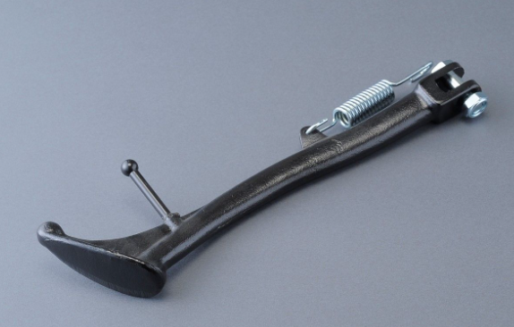 Metal lever with springs on a gray background
