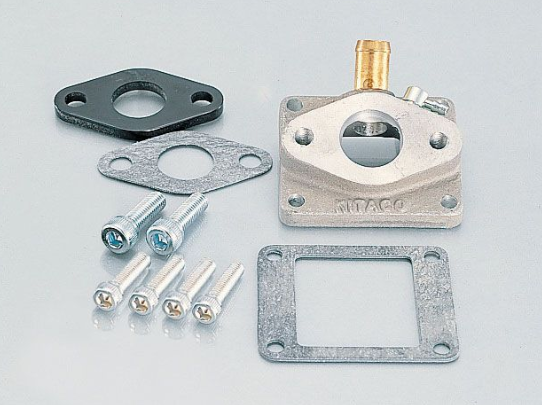 Mechanical parts including a metal block, gaskets, and screws on a light gray background