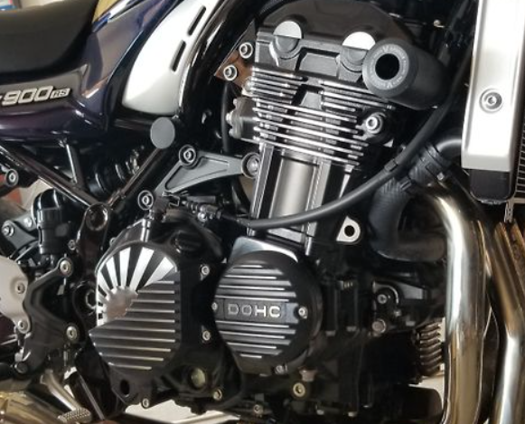 Close-up of a motorcycle engine with 'DOHC' branding