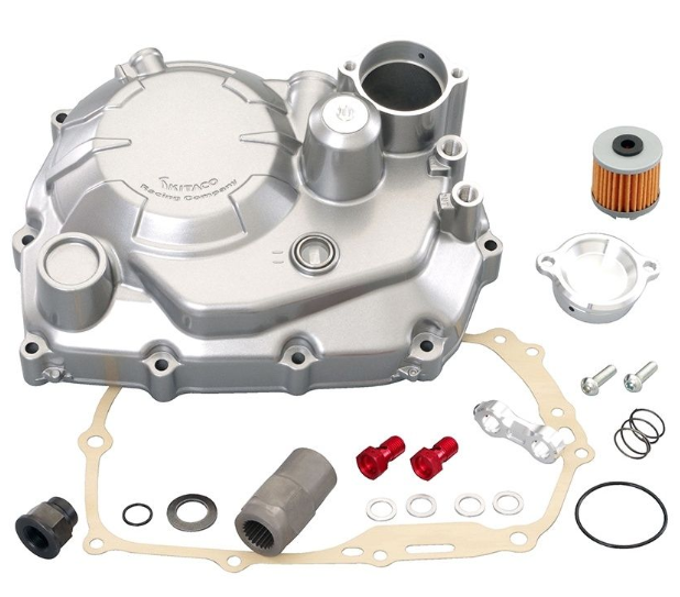 Engine parts including a silver metal housing, filter, and gaskets on a white background.