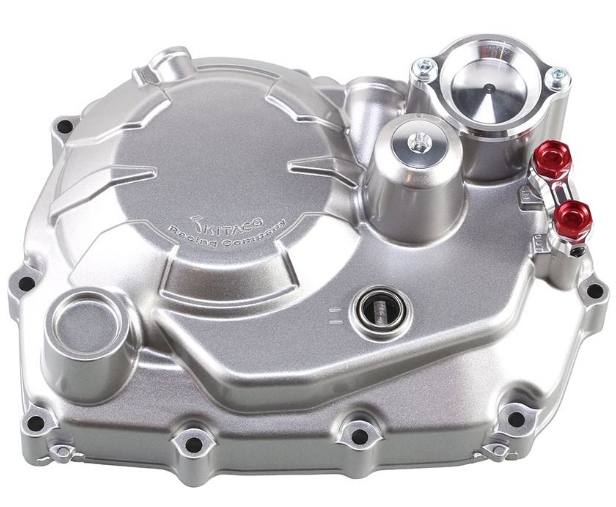 Silver mechanical component with red accents on a white background