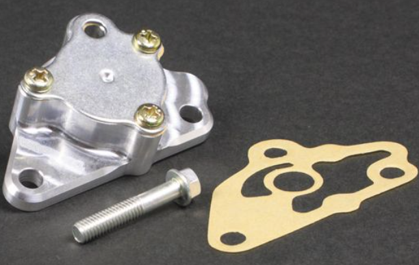 Metallic mechanical component with screws and a gasket on a dark background