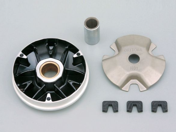 Mechanical components including a black and silver gear, a cylindrical metal piece, and four smaller metallic pieces on a gray background.