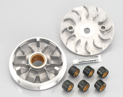 Two metallic rotary engine parts with small black and gold components on a gray background