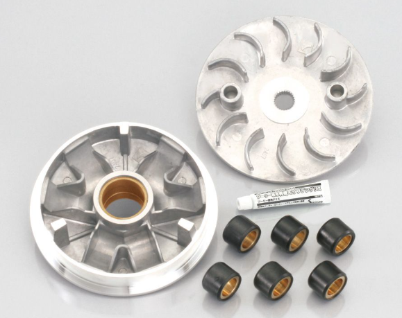 Two metallic rotary engine parts with small black and gold components on a gray background