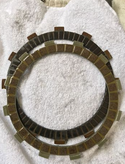 Clutch plate on a textured white background