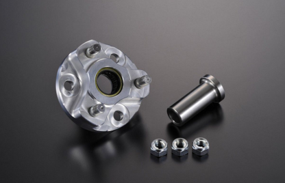 Metallic wheel hub assembly with bolts on a dark background
