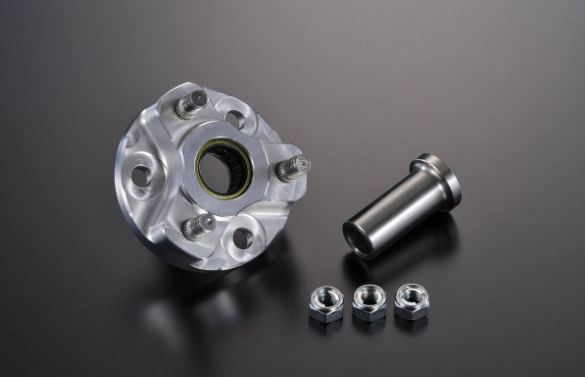 Metallic wheel hub assembly with bolts on a dark background