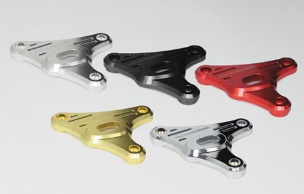 Five metal brackets in different colors on a white background
