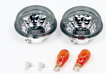 Two car fog lights with two orange bulbs on a white background