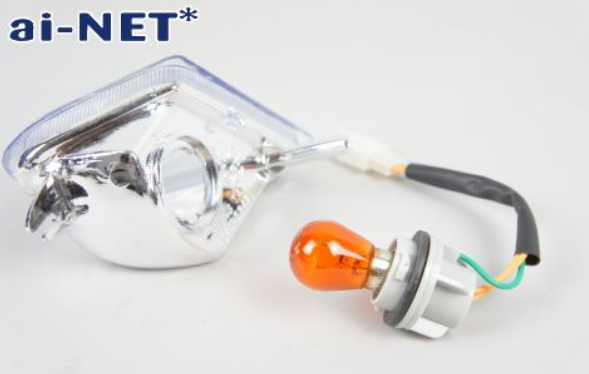Car headlight assembly with orange bulb on a white background, featuring the ai-NET* brand.
