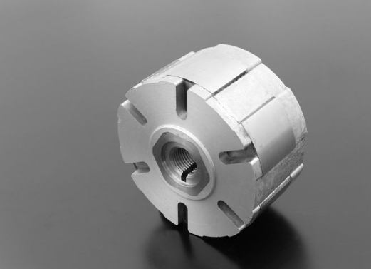 White mechanical component on a gray background