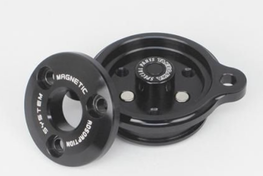 Two black metal components with 'Magnetic' and 'System' text on a white background