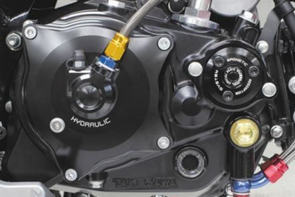Close-up of a motorcycle hydraulic system with visible branding.