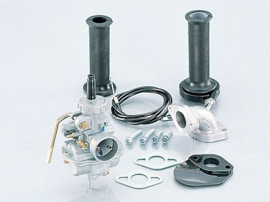 Motorcycle carburetor and related parts on a white background