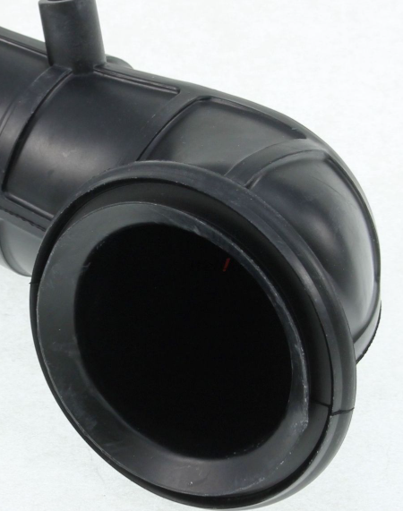 Close-up of a black plastic pipe fitting on a white background