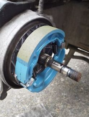 Close-up of a mechanical component with blue and gray parts on a blurred background
