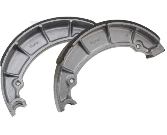 Two metallic brake shoes on a white background