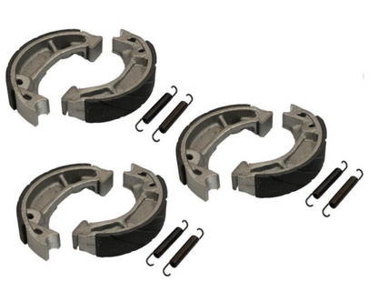Set of brake shoes and springs on a white background