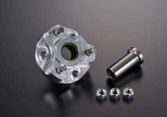 Metallic wheel hub assembly with bolts on a dark background