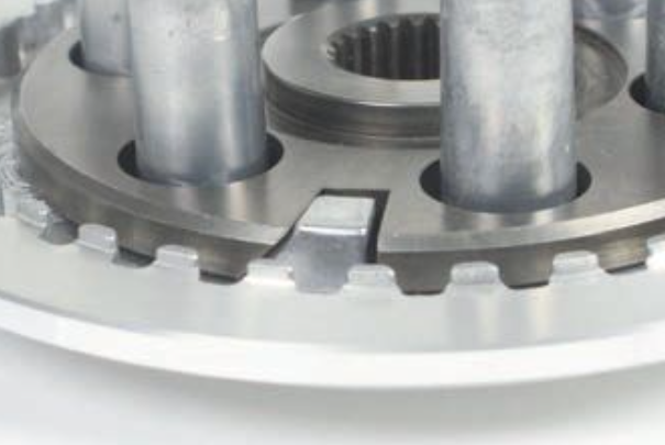 Close-up of a mechanical gear system on a white background