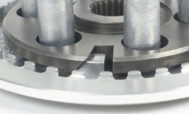 Close-up of a metal gear mechanism on a white background