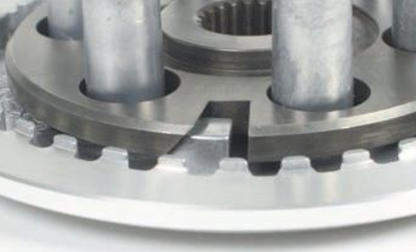 Close-up of a metal gear mechanism on a white background