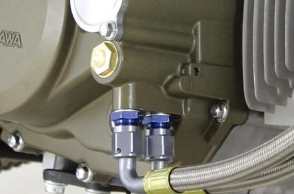 Close-up of a mechanical engine component with visible branding