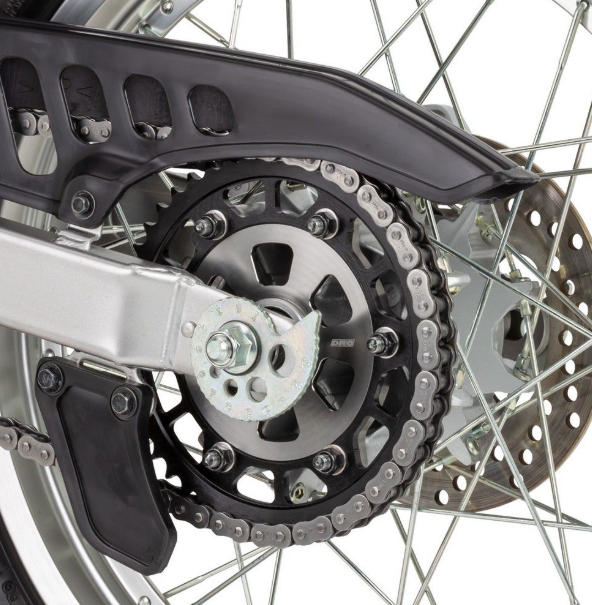 Close-up of a motorcycle chain and sprocket system.