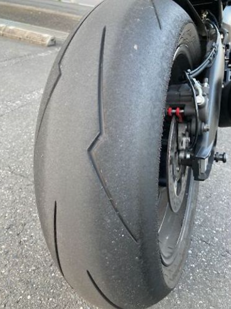 Close-up of a motorcycle tire on a road