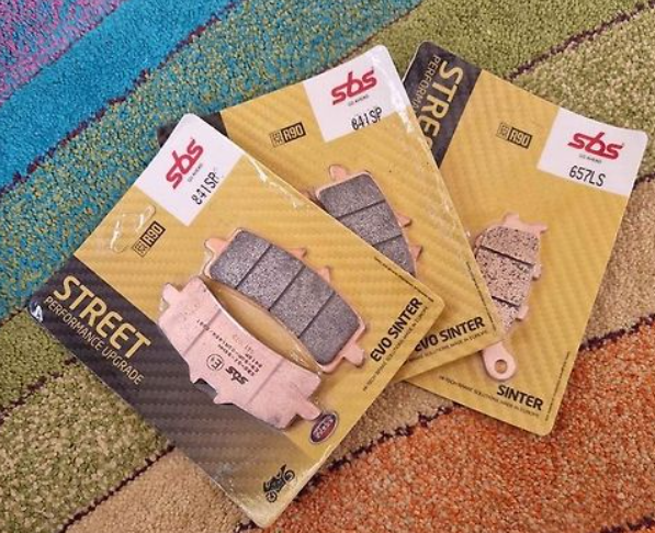 Brake pads in packaging on a textured surface