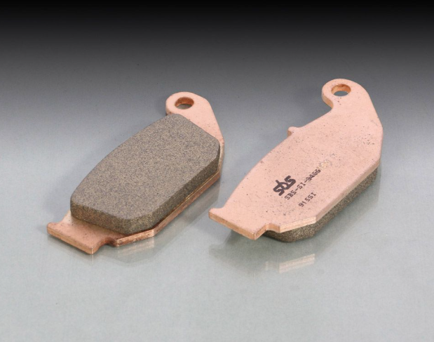 Two brake pads on a gray background