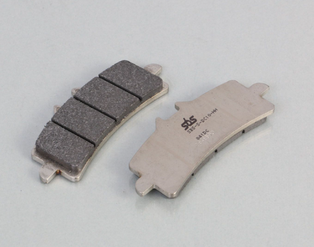Two brake pads with a brand logo on a gray background