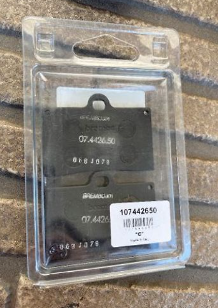 Black electronic component in clear packaging on a textured surface