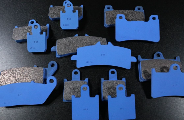 Blue brake pads on a black background
