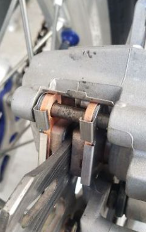 Close-up of a mechanical component with copper wiring