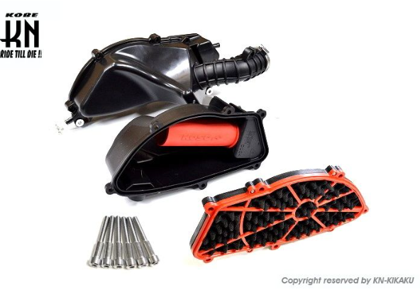 Motorcycle parts including a black and red exhaust and a chain on a white background with KON-KAKU branding.