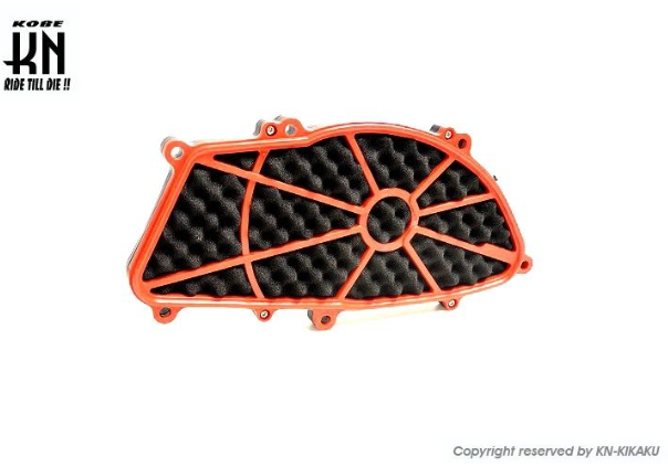 Orange and black motorcycle part with KNR logo on a white background