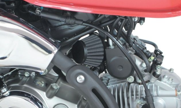 Close-up of a motorcycle engine with a red cover