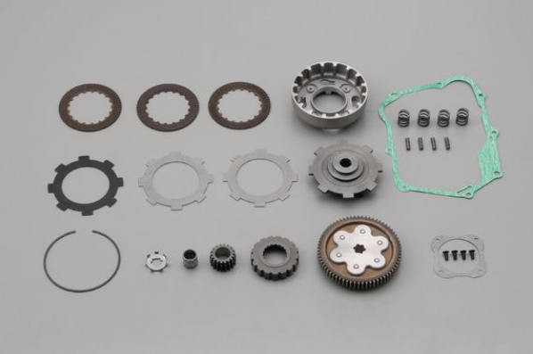 Collection of mechanical gears and components on a gray background